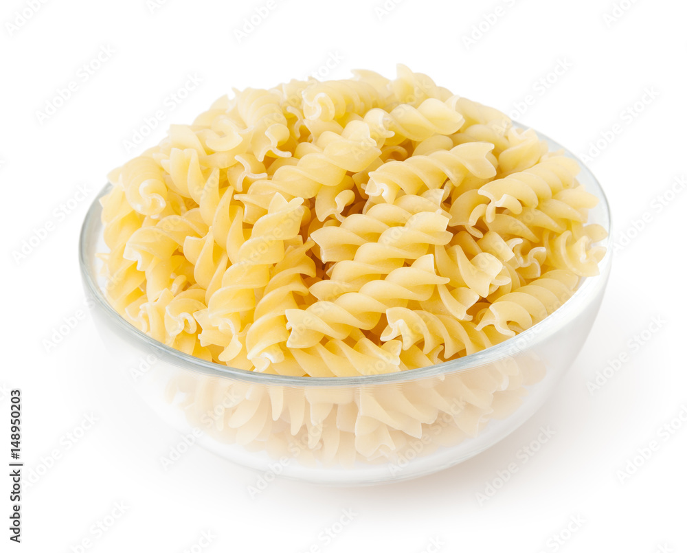 Fusilli pasta in bowl isolated on white background with clipping path