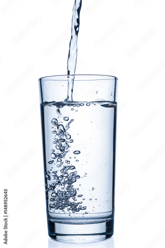 Flowing pure water into tumbler on white background Flowing pure water into tumbler on white background