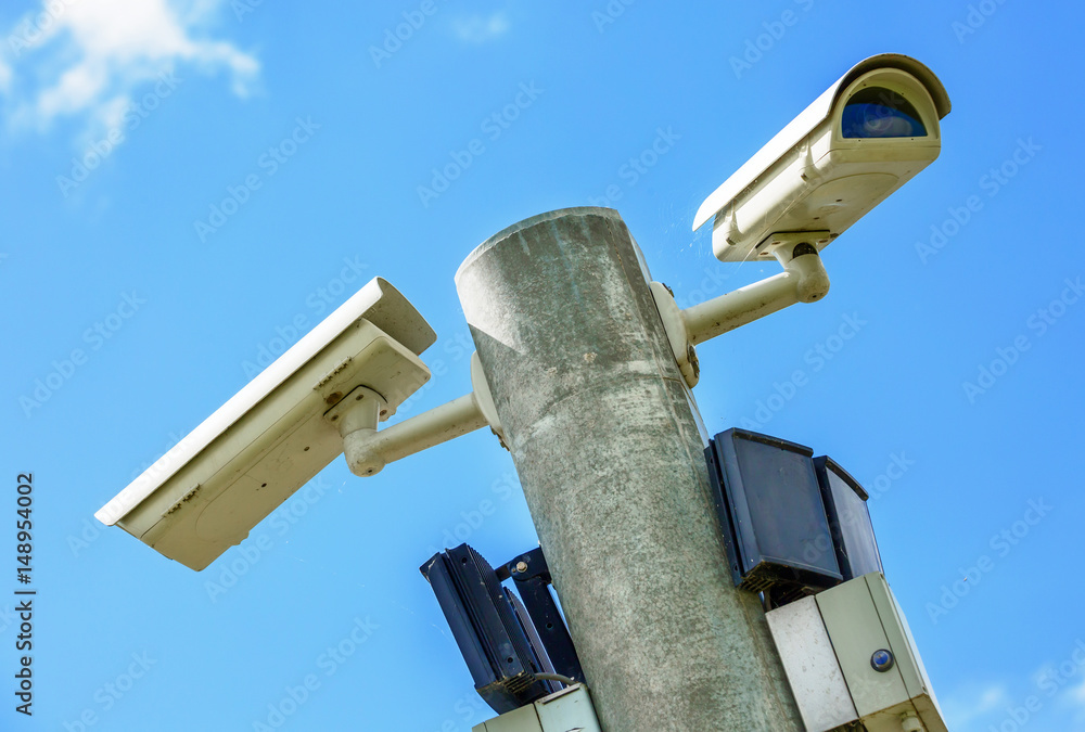 CCTV Security camera and urban video. Closeup view. CCTV Security camera and urban video. Closeup view.