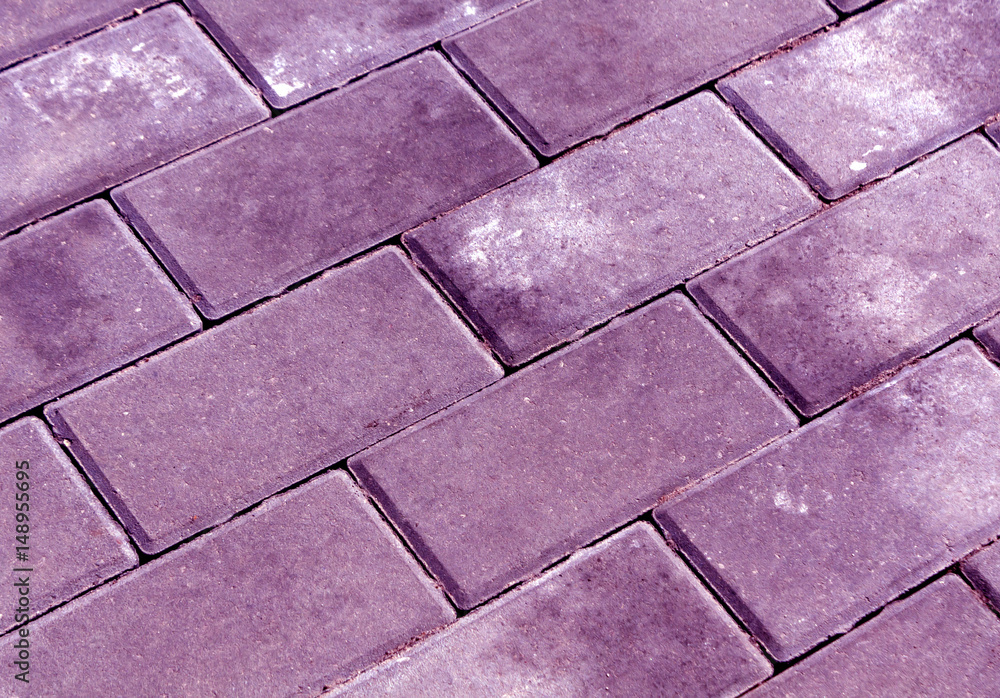 Obraz premium Violet color cobblestone pavement texture.