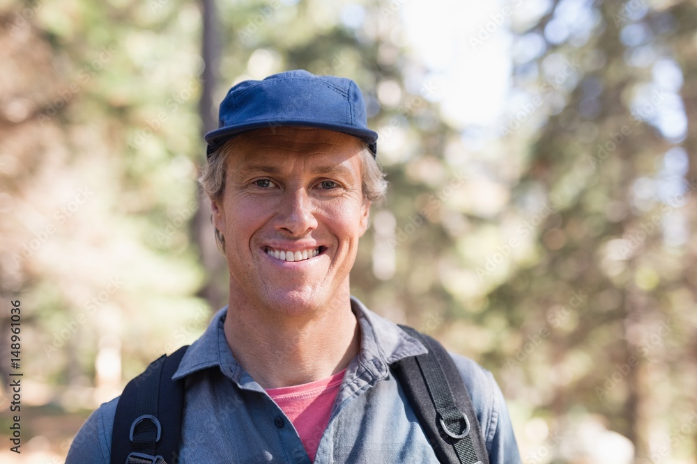 Portrait of happy hiker wearing blue cap Portrait of happy hiker wearing blue cap