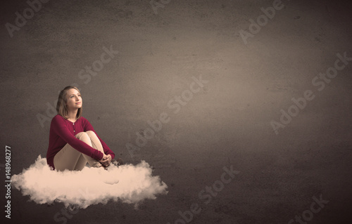 Woman sitting on a cloud with plain bakcground