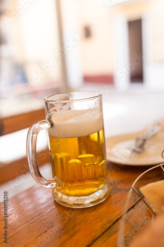 Beer mug on the table in a cafe