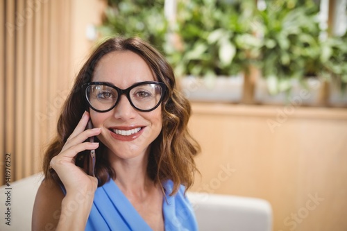 Portrait of executive talking on mobile phone