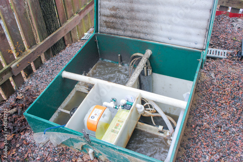 Opened the septic tank to check its functionality. Outdoor Septic Tank. Clogged Septic tank, is full. The water leaves the septic tank..