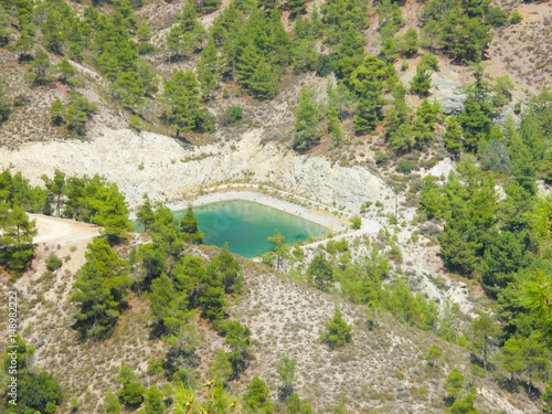 reservoir in the mountains in the woods. mountain lake to irrigate the fields, in the mountains.. photo