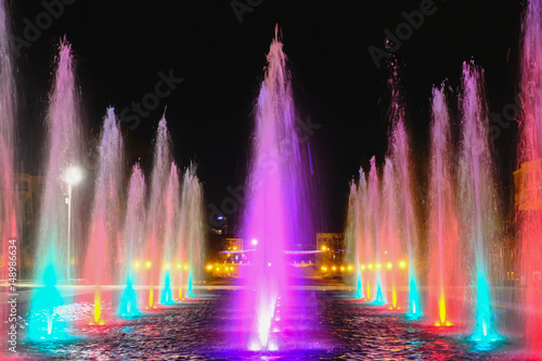 colored water fountain at night 