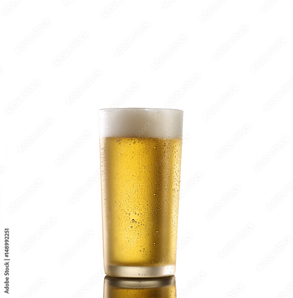 Fresh beer in a glass on a white background. The concept of food. Fresh beer in a glass on a white background. The concept of food.