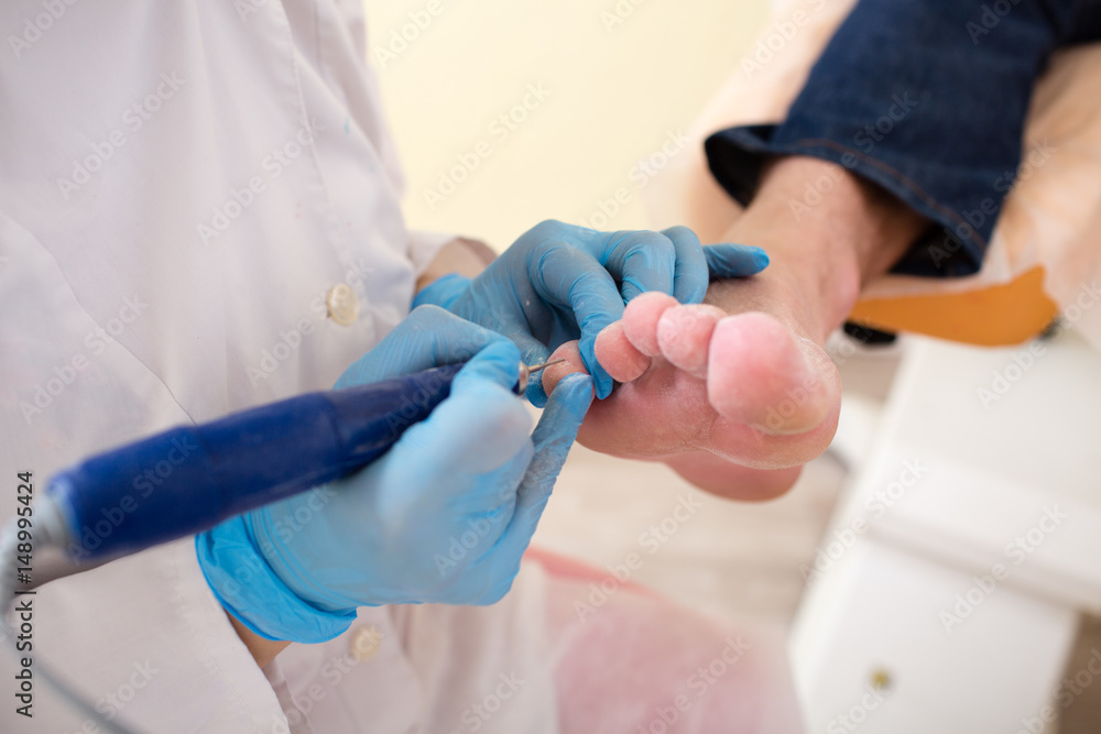 Master chiropody shapes the nails . Hardware manicure. Concept body care. Master chiropody shapes the nails . Hardware manicure. Concept body care.