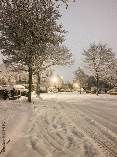 Snowy night time street scene.