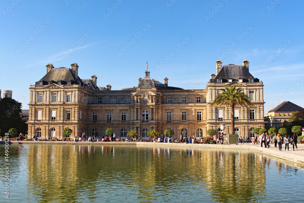 View on Luxembourg palace and garden with reflection and fountain, front view, paris city, france