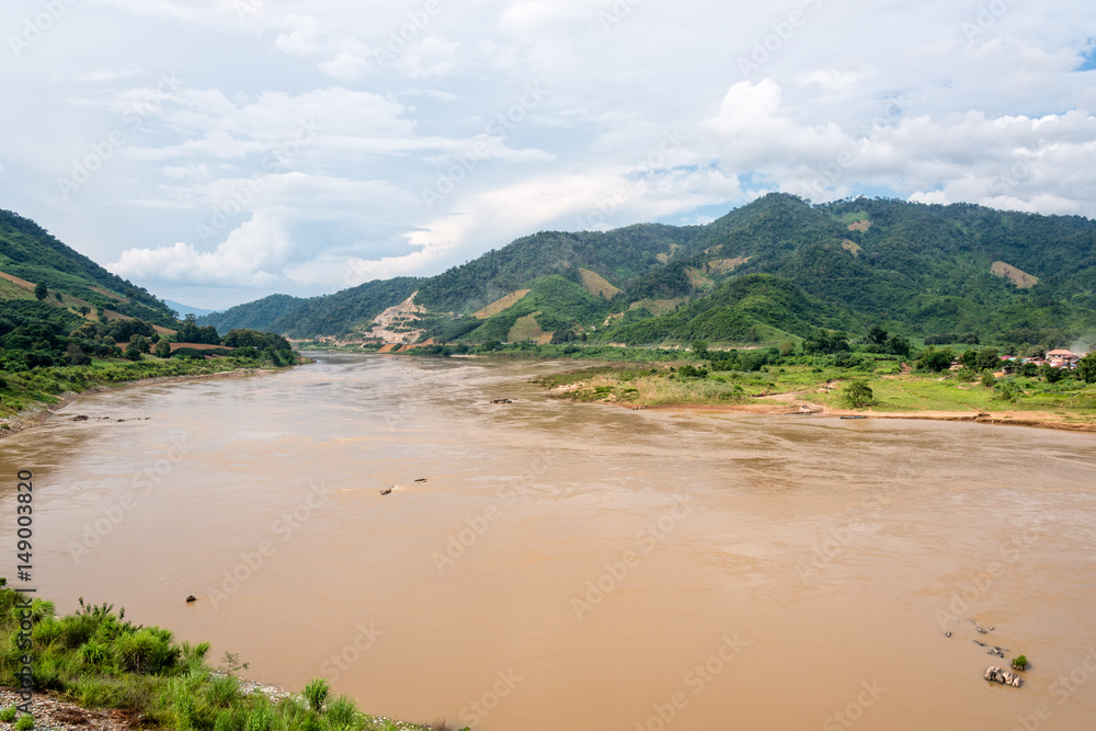 Natural landscape of Mekong River is a muddy color flowing through the mountains, is the border between Thailand and Laos photo is taken in Chiang Rai Province, Thailand Natural landscape of Mekong River is a muddy color flowing through the mountains, is the border between Thailand and Laos photo is taken in Chiang Rai Province, Thailand