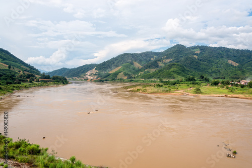 Natural landscape of Mekong River is a muddy color flowing through the mountains, is the border between Thailand and Laos photo is taken in Chiang Rai Province, Thailand