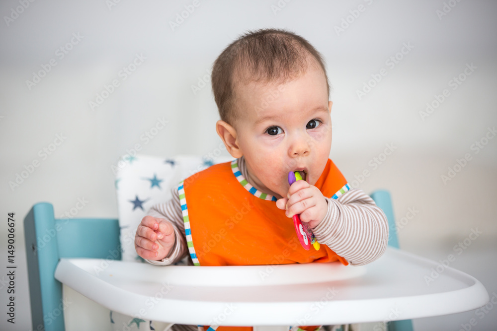Baby laughing during lunch time. (6 months old). Baby laughing during lunch time. (6 months old).