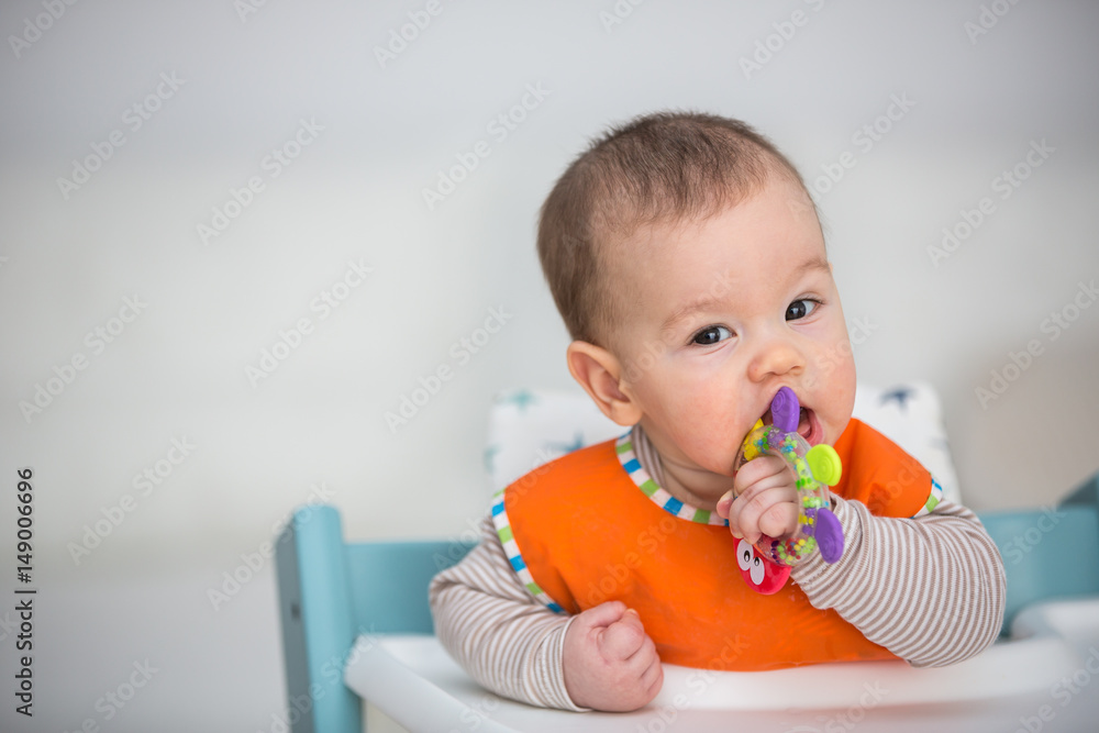Baby laughing during lunch time. (6 months old). Baby laughing during lunch time. (6 months old).