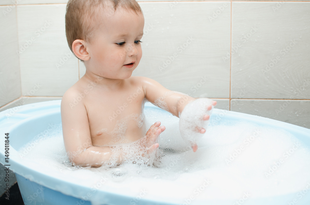 Happy baby boy taking a bath Happy baby boy taking a bath