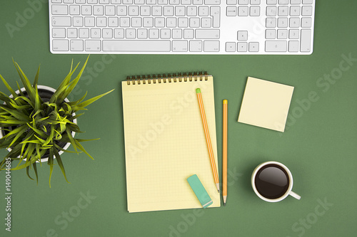 Green office table and notepad photo