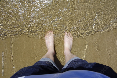 Getting feet wet in the sea.