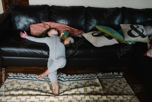 Girl resting against couch photo