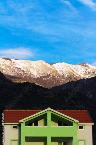 Cottage in non-urban area under mountains © tartalja
