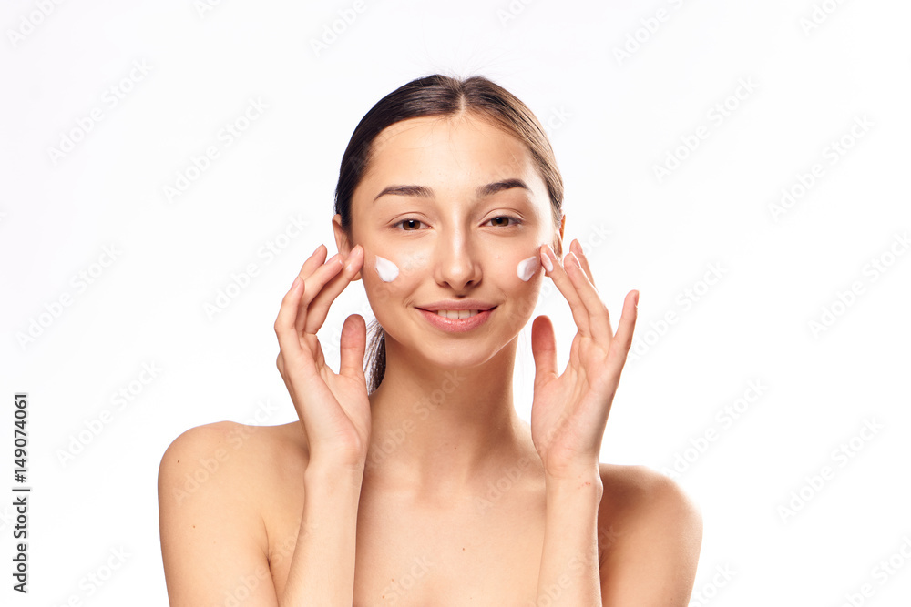 happy lady with moisturizer on face happy lady with moisturizer on face