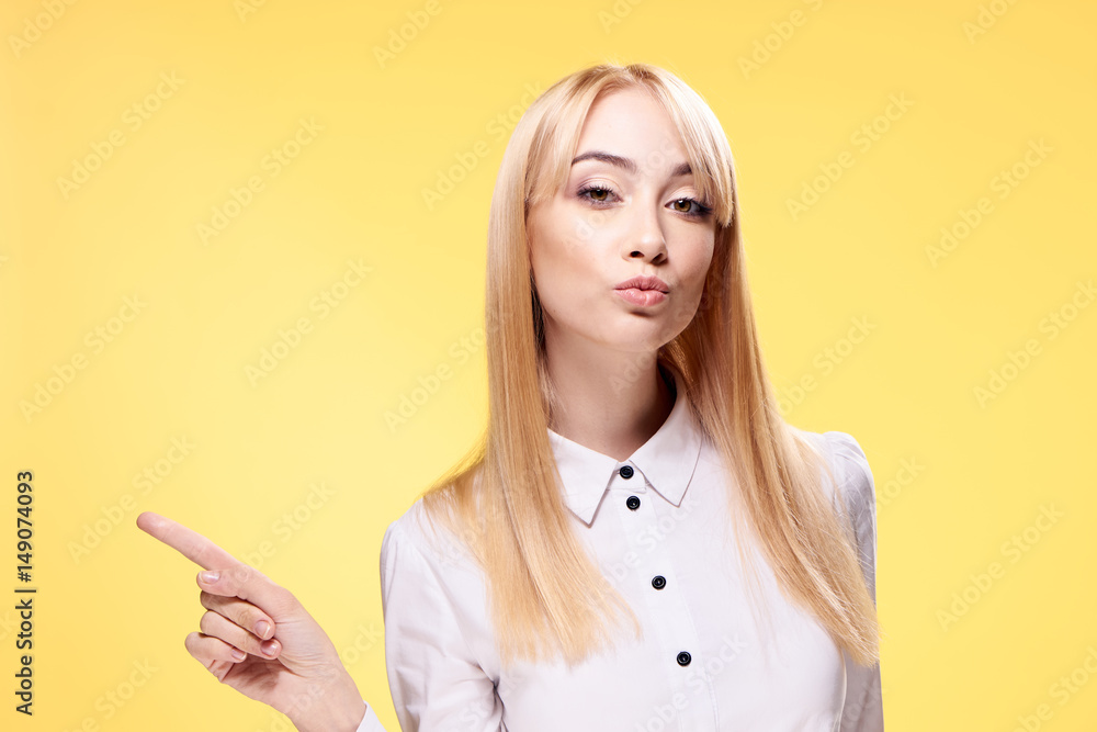 woman in a light shirt on a yellow background woman in a light shirt on a yellow background
