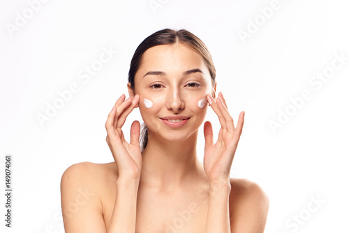 happy lady with moisturizer on face