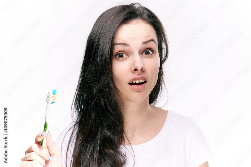 woman with toothbrush, surprise, misunderstanding woman with toothbrush, surprise, misunderstanding