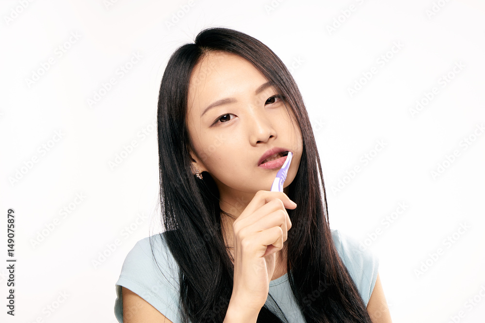 beautiful brunette with a purple toothbrush beautiful brunette with a purple toothbrush
