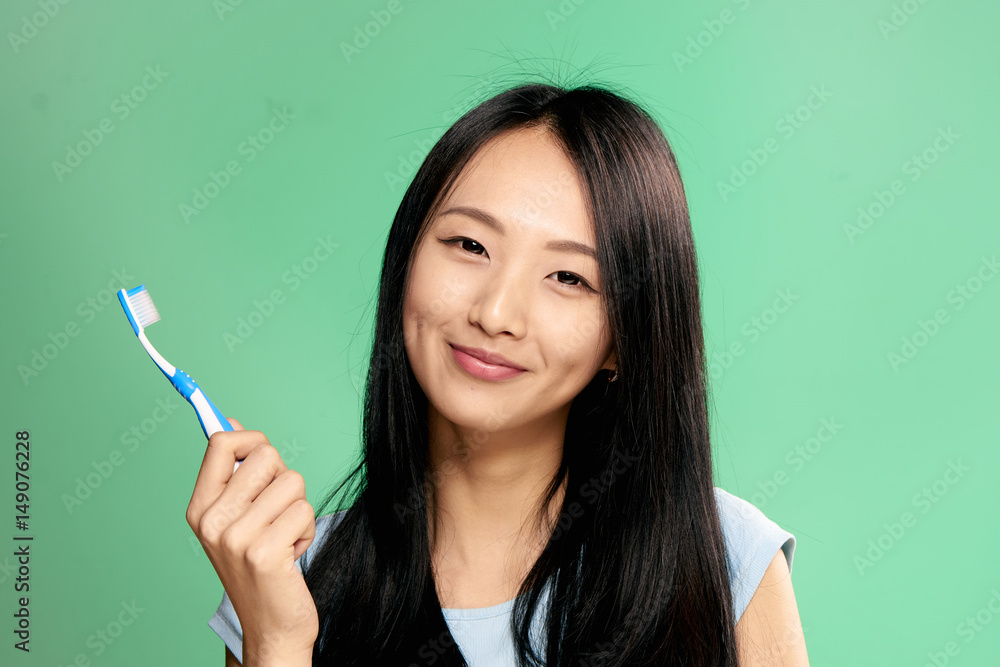 Obraz premium the woman in a light T-shirt. toothbrush, hygiene...