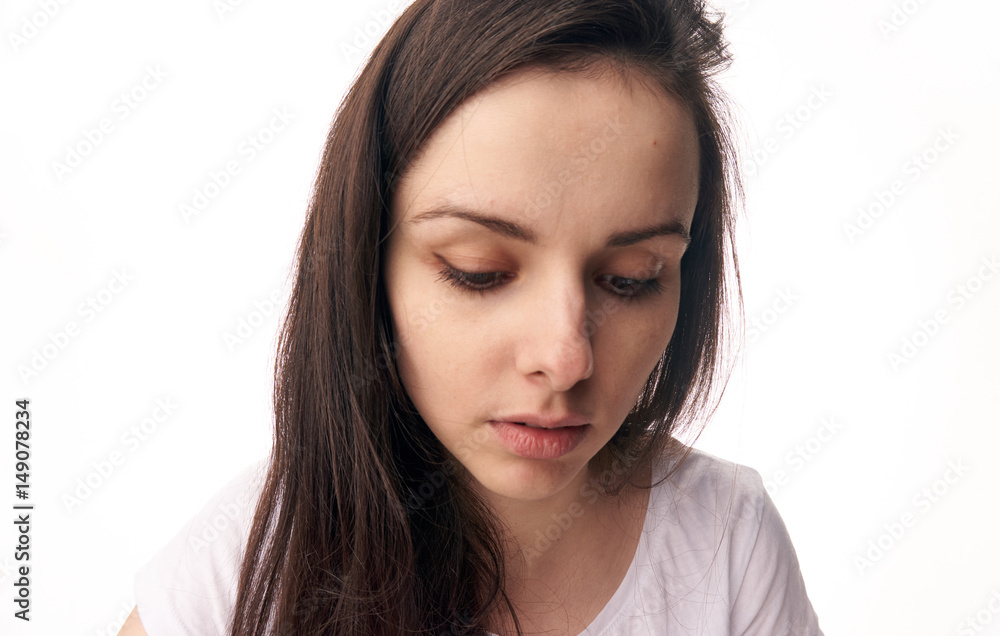 embarrassed woman with a lowered head embarrassed woman with a lowered head