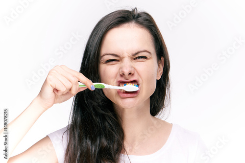 woman cleans teeth, gum massage