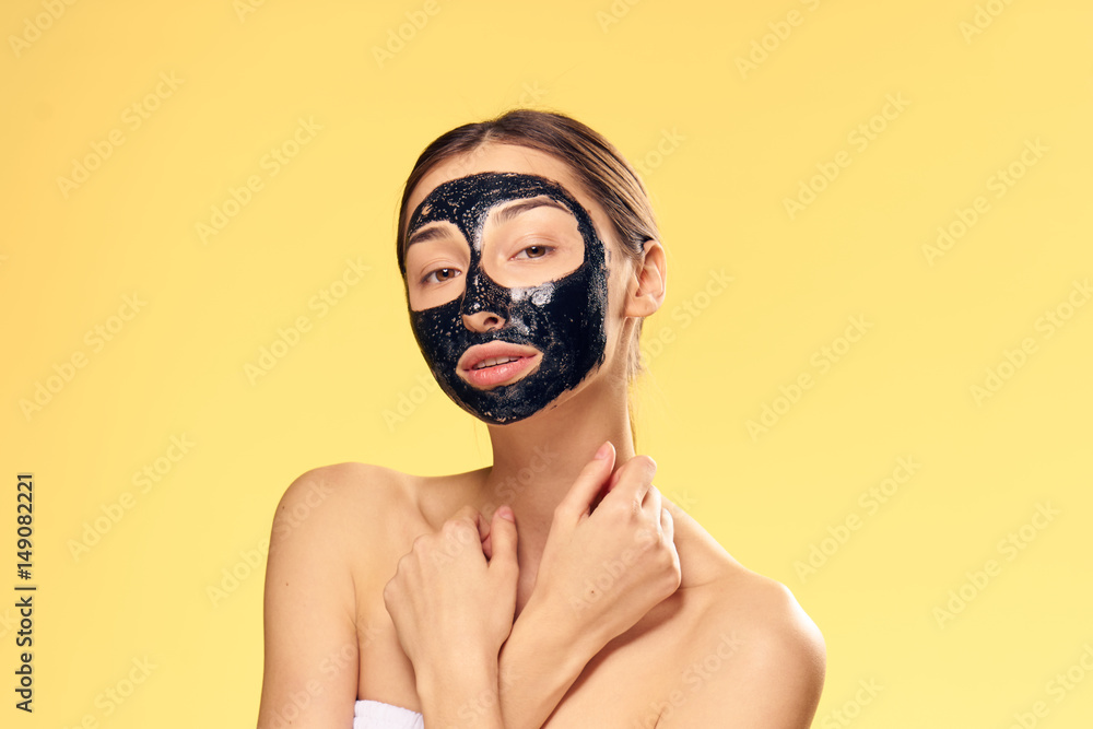 dark mask on the face of a young lady dark mask on the face of a young lady