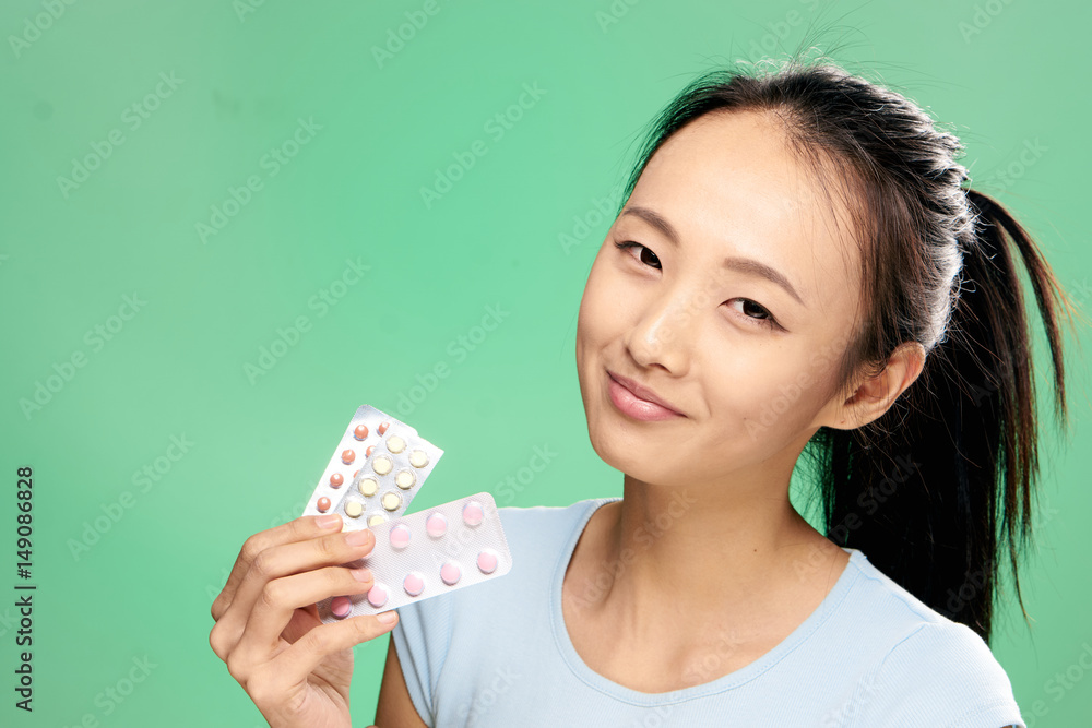 woman with colorful tablets