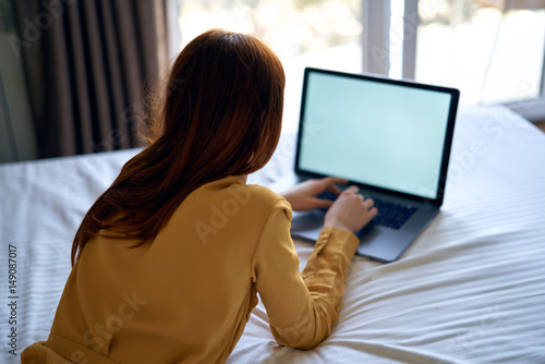 woman typing on laptop keyboard