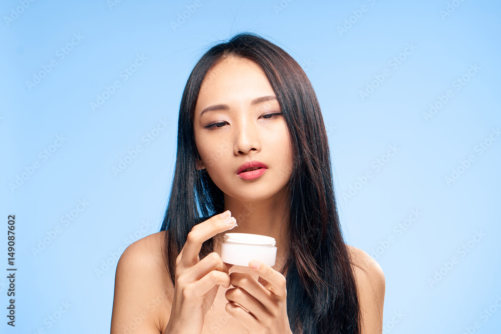 woman with a jar of cream woman with a jar of cream