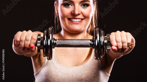 athletic woman working with heavy dumbbells