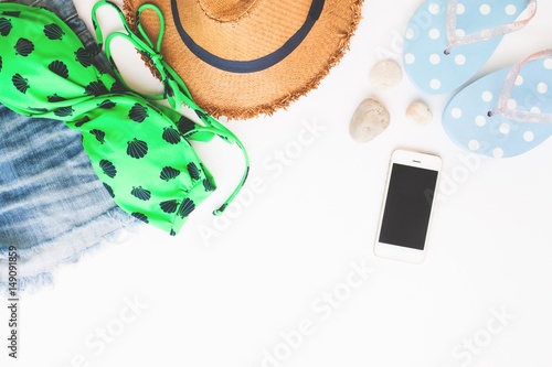 Flat lay of beach items and smart phone, Summer concept on white background with copy space, Top view
