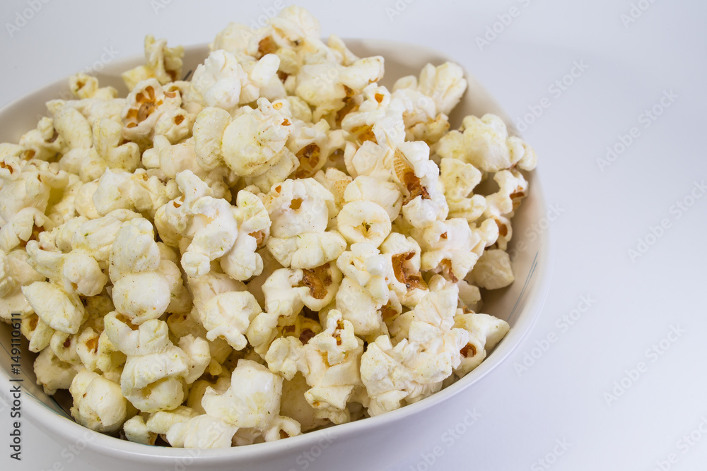 Popcorn in white bowl closeup image white background