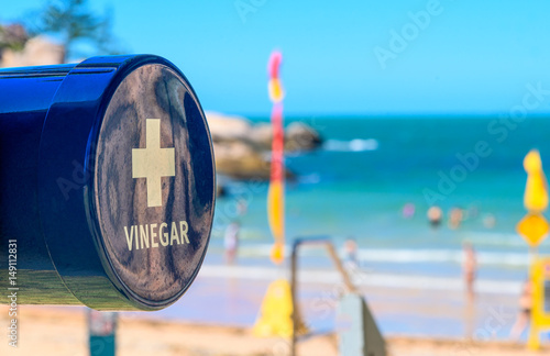 Canvas Print A vinegar station on the beach for treating a marine stinger sting at Alma Beach