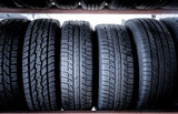 Car tires at warehouse in tire store, useful for background.