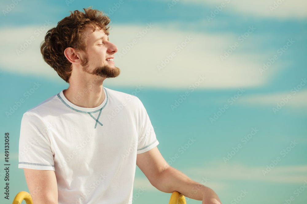 Man with closed eyes relaxing breathing fresh air. Man with closed eyes relaxing breathing fresh air.