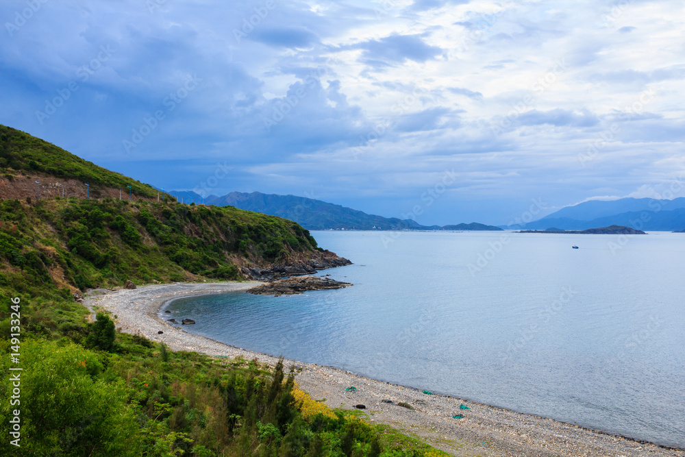 Fototapeta premium Nha Trang bay, Vietnam. View from Pham Van Dong (657) highway. Nha Trang is well known for its beaches and scuba diving and has developed into a destination for international tourists.