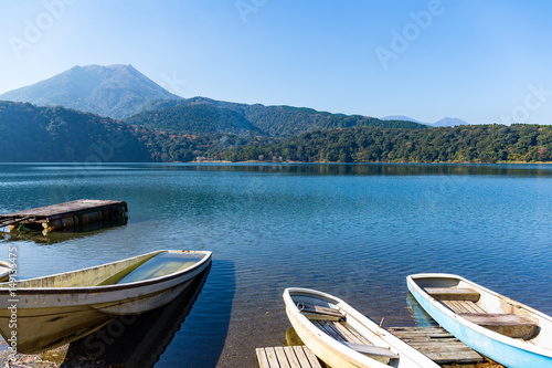 Mount Kirishima and lake with boat