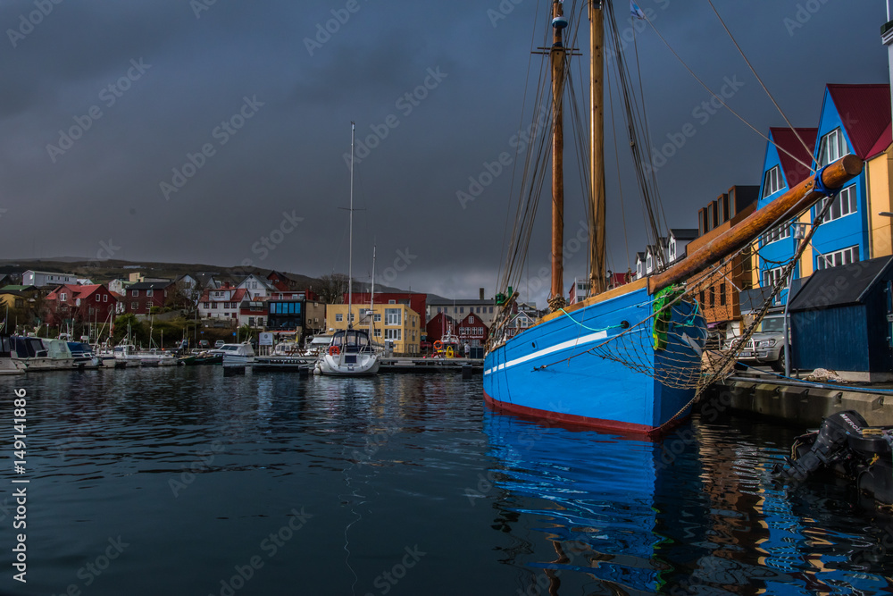 An old city harbor with boats