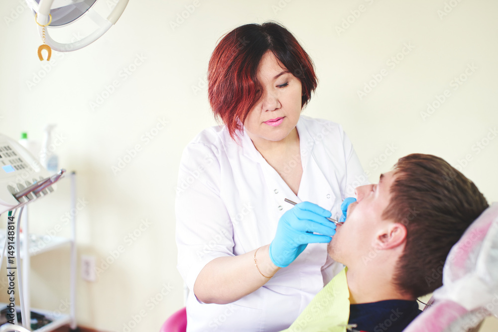 Obraz premium Kazakh dentist at work