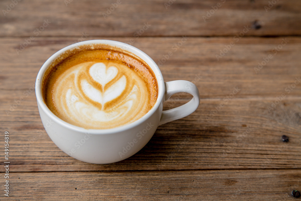 cup of coffee on wood table blackground cup of coffee on wood table blackground