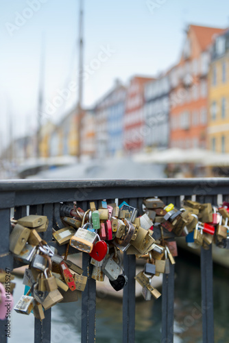 Bridge in Nyhavn, Copenhagen with friendship padlocks. Shallow depth of field.