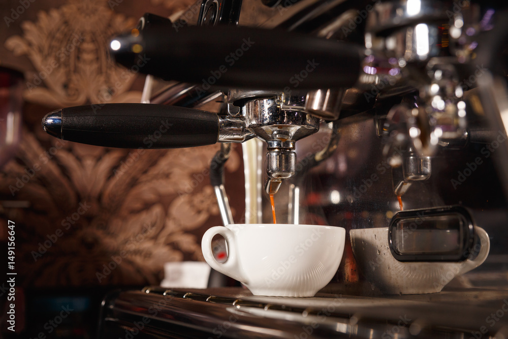Coffee machine in a cafe pours fresh espresso Coffee machine in a cafe pours fresh espresso