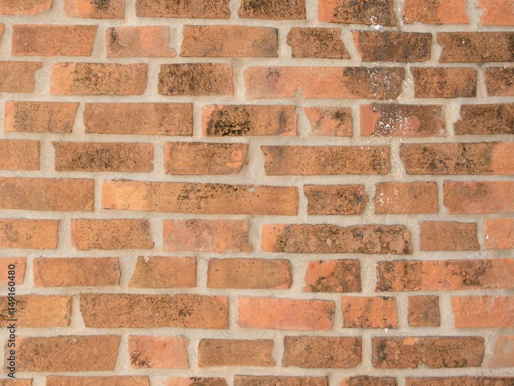 Obraz premium Closeup of brown red brick wall as texture or background.